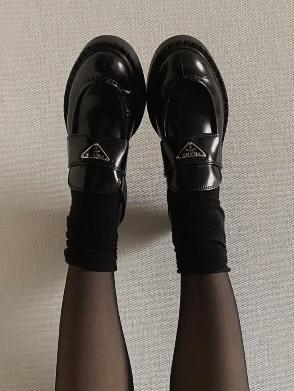 Prada Black Leather Loafers with Logo Triangle Accent